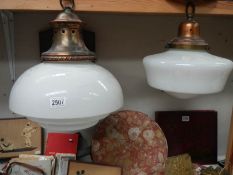 Two large art deco glass lampshades with copper fittings.
