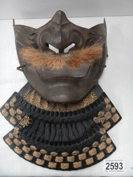 An early Samurai Menpo mask.