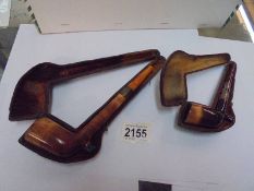 Two cased vintage pipes.