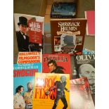 A box of movie and movie star related books.