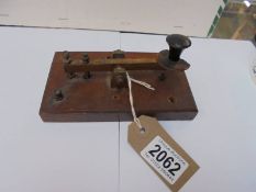 A morse code key.