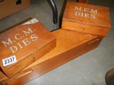 Three boxes of M.C.M dies for sealing.