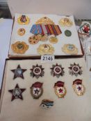 A collection of replica Russian medals and badges.