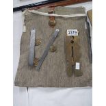 A map pouch, brass button polishing shield. etc.,