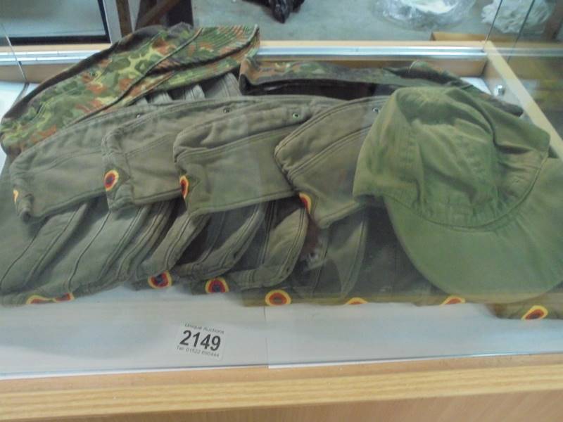 Approximately 15 military caps/bonnets.