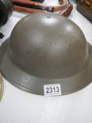 A tin helmet serial No., VB56 SSLN