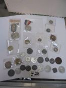 A collection of old coins and medals.