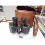 A cased set of Hunsicher & Alexis Paris military binoculars.