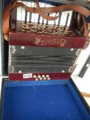 A cased vintage Tonella piano accordian, made in Gemany,