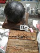 Pieces of decking from HMS Victory taken during restoration 1922/23 and a 7lb cannon ball.