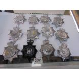 Twelve large police badges for various constabularys.