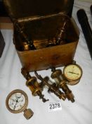 An old metal gas mask case containing gauges etc.,