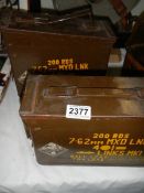 Two metal ammo boxes.