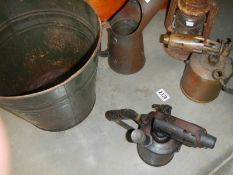 An old oil can, hurricane lamp, metal waste bin etc.,