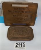 A brass bed plate 'First Battalion The Green Howards' NO. 4379920 H Foster and a brass buckle.
