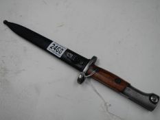 A Belgian SA30 bayonet with double edged blade.