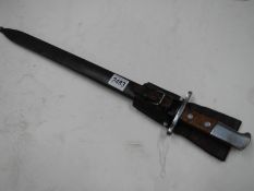 A saw back bayonet stamped HS serial No. 79933 with scabbard, blade 48 cm.