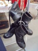 A pair of flying boots and a pair of army boots, size 8.