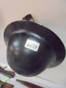 A WWII British wardens helmet.