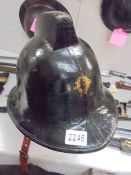 A late Victorian firemans helmet.