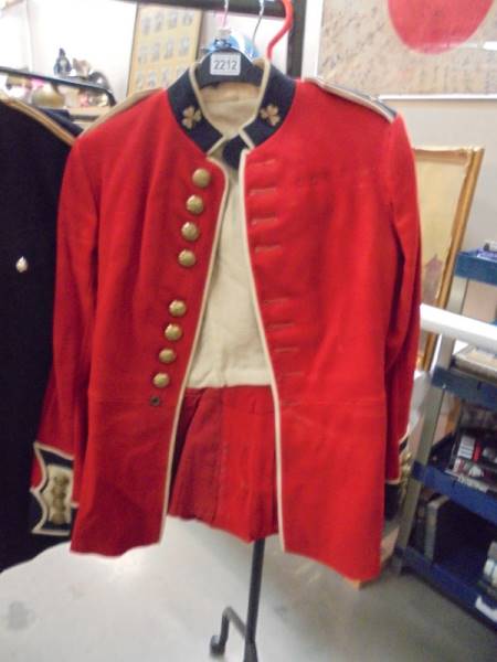 An Irish Guards brass buttons jacket and trousers, pre 1952.