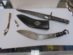 A WW1 Combles trench art letter opener, shell case with cross, WW2 bayonet and a Kukri.