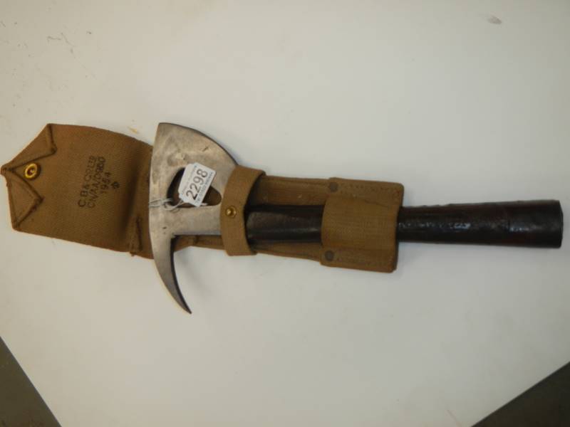 Possibly a WW2 fire service axe or an RAF escape/rescue axe