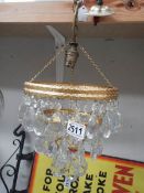 A good brass and glass chandelier.