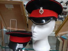 A Household Cavalry cap and one other.