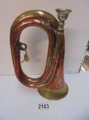 A brass and copper bugle..