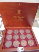 A cased set of twelve English Civil War coins.