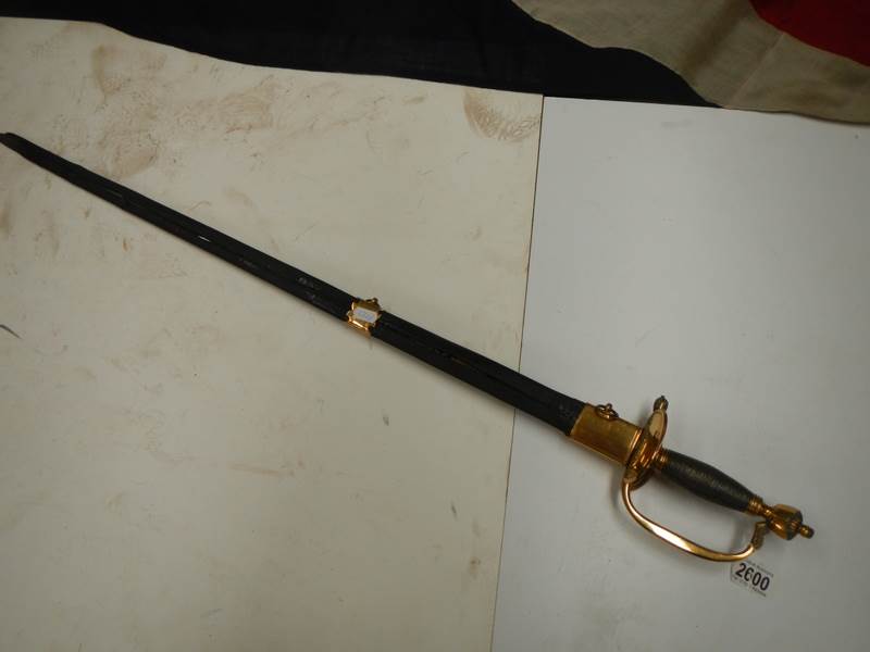 An early sword with brass hilt and in scabbard. COLLECT ONLY.