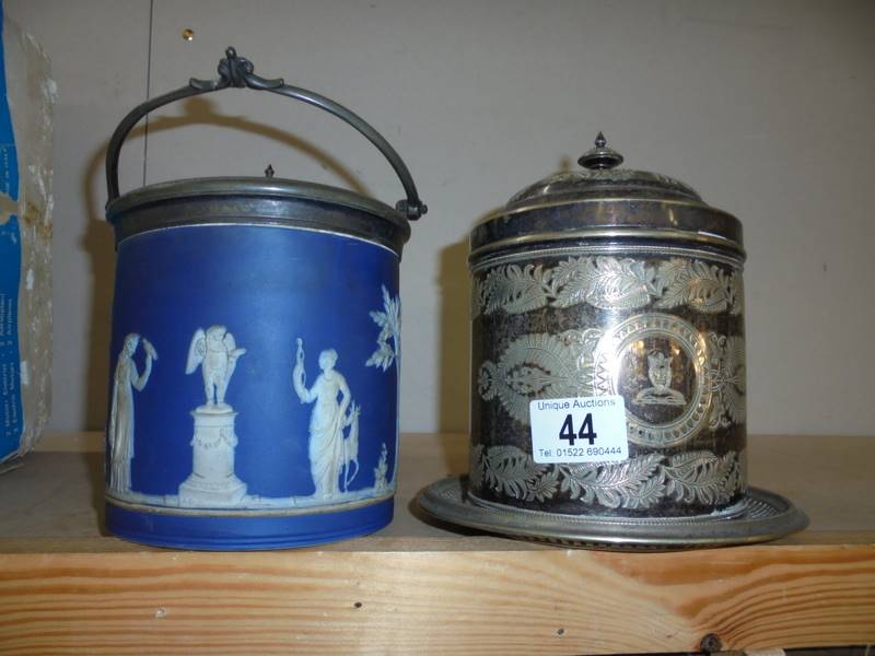 A Jasper ware biscuit barrel and a silver plate biscuit barrel.