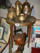 A mixed lot of metalware including tea set, table, copper electric kettle etc., COLLECT ONLY.