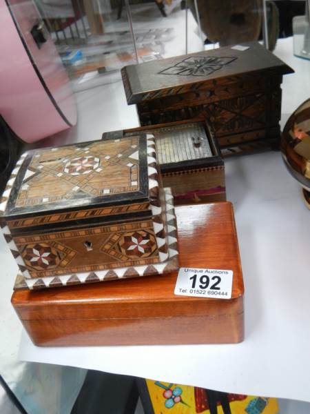 An inlaid box and three others.