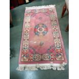 A pink wool rug, COLLECT ONLY.
