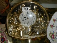 A Rhythm quartz clock.