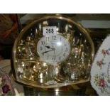 A Rhythm quartz clock.