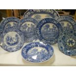 A Blue and white meat platter and seven blue and white plates.