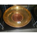 A brass and copper bowl.