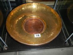 A brass and copper bowl.