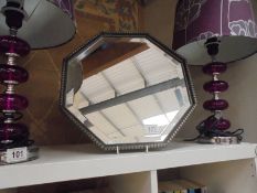 An octagonal bevel edged mirror, COLLECT ONLY.