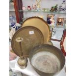 Two brass trays, a brass bowl and two other items.