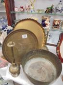 Two brass trays, a brass bowl and two other items.