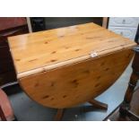A pine drop leaf dining table, COLLECT ONLY.