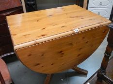 A pine drop leaf dining table, COLLECT ONLY.