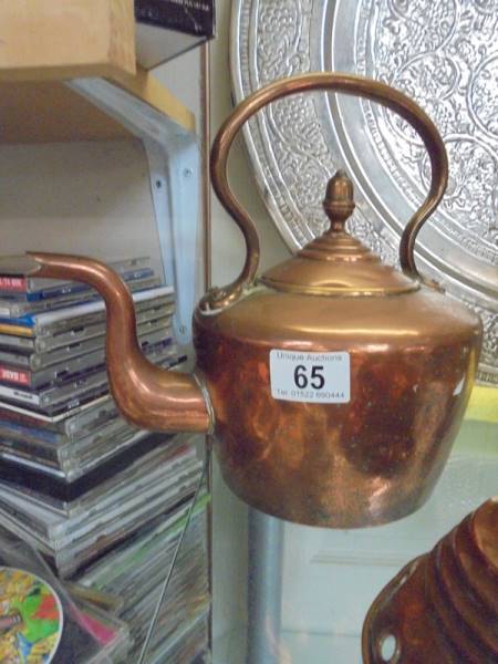 A Victorian copper kettle and a copper washing posher. - Image 2 of 3