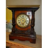 A mahogany mantel clock.