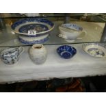A mixed lot of blue and white ceramics.