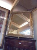 A gilt framed bevel edged mirror, COLLECT ONLY.